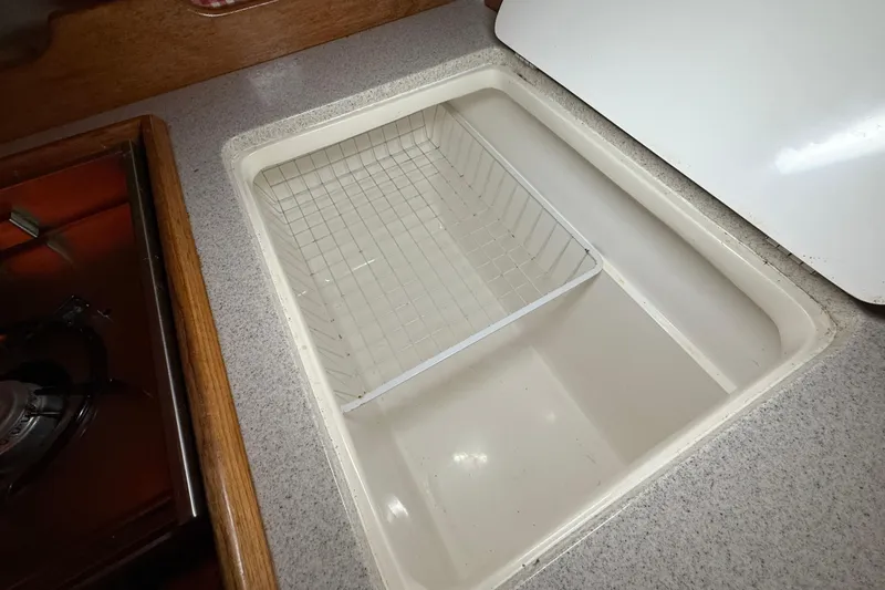Slide: The Image of Galley sink with wire basket in 2006 Catalina 36 MkII yacht. - 61