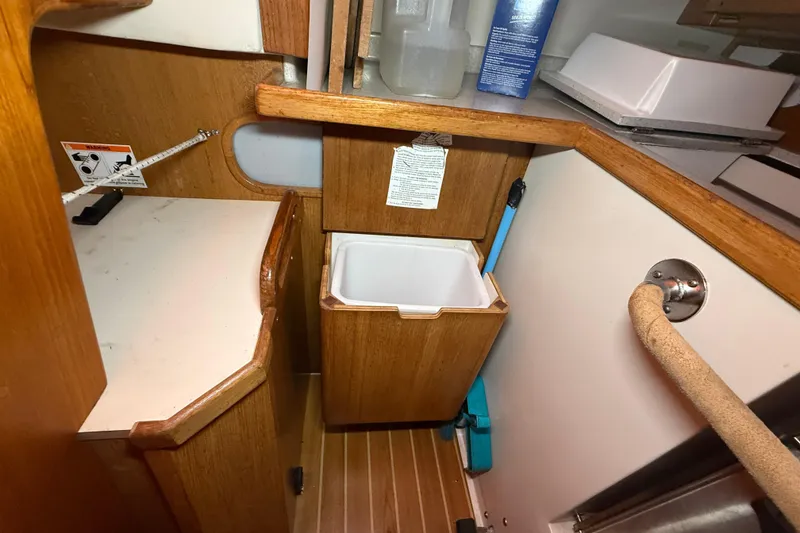 Slide: The Image of Interior of 2006 Catalina 36 MkII sailboat with wooden cabinetry and storage area. - 62
