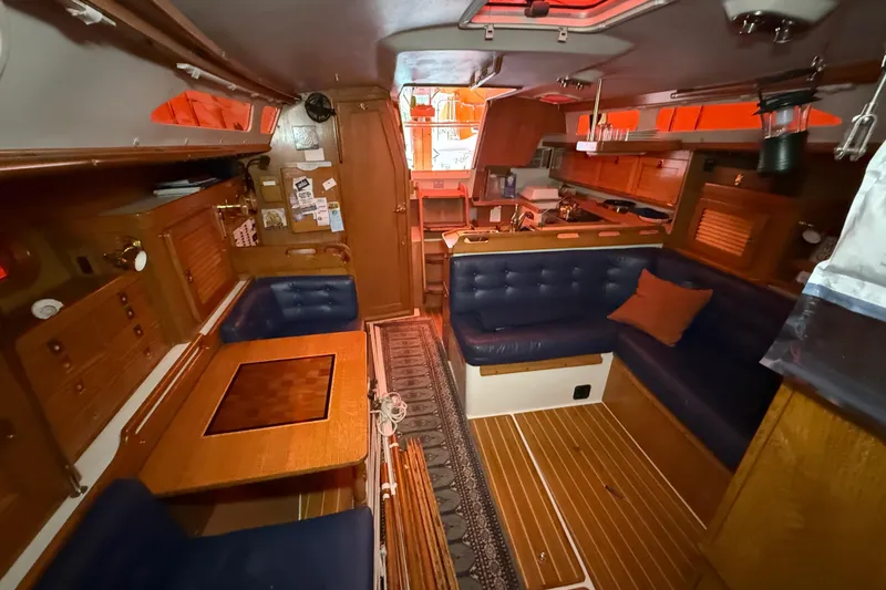 Slide: The Image of Interior of a 2006 Catalina 36 MkII sailboat with cozy seating and wooden finishes. - 64