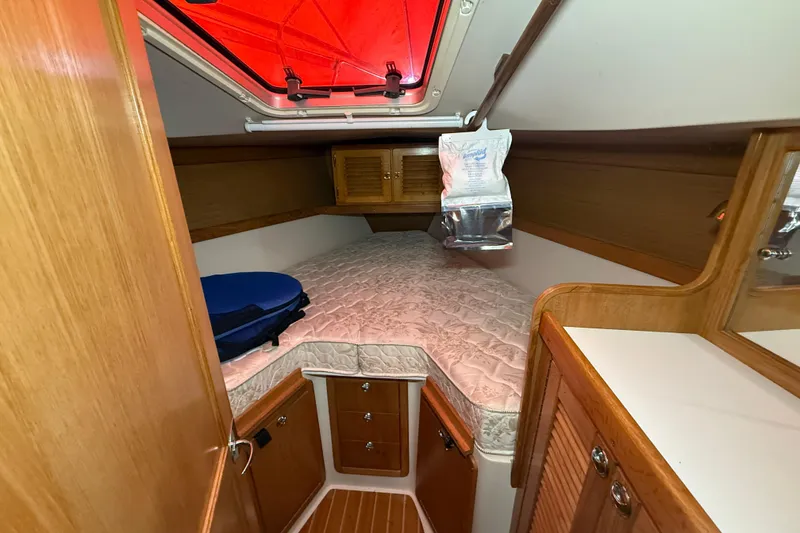 Slide: The Image of Cozy cabin interior of 2006 Catalina 36 MkII sailboat with wooden finish. - 65