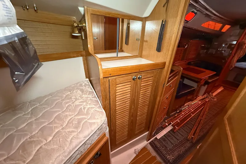 Slide: The Image of Interior of 2006 Catalina 36 MkII sailboat with wooden cabinetry and cozy sleeping area. - 66