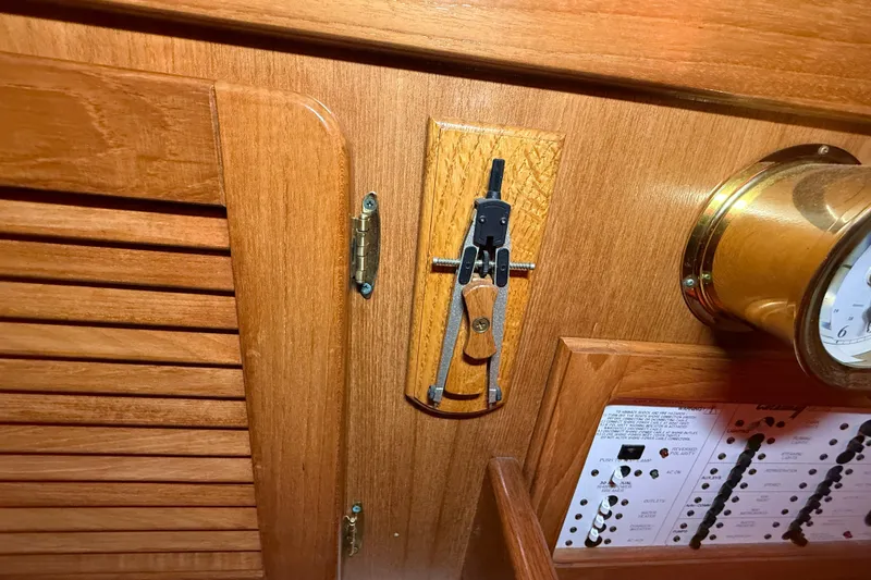 Slide: The Image of Interior of 2006 Catalina 36 MkII sailboat with wooden paneling and nautical instruments. - 75