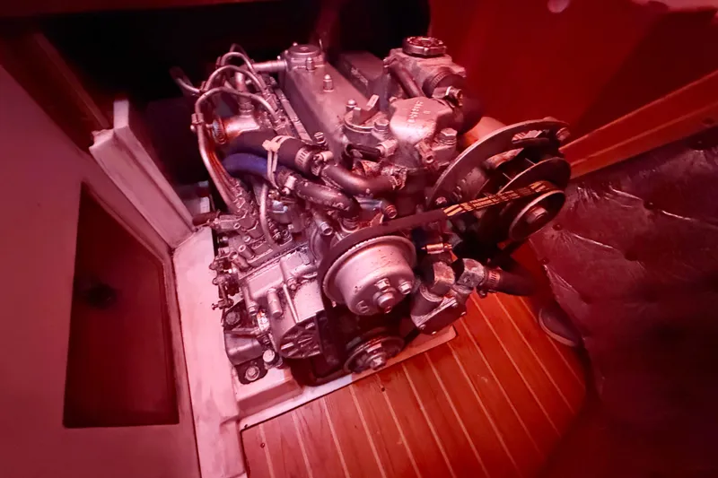 Slide: The Image of Engine of a 2006 Catalina 36 MkII sailboat, illuminated in red light. - 77