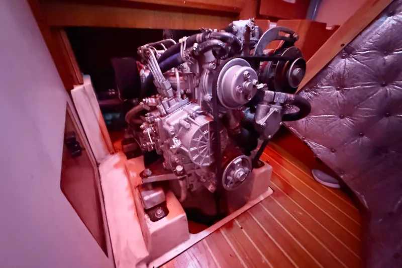Slide: The Image of Engine compartment of a 2006 Catalina 36 MkII sailboat, showcasing mechanical components. - 79