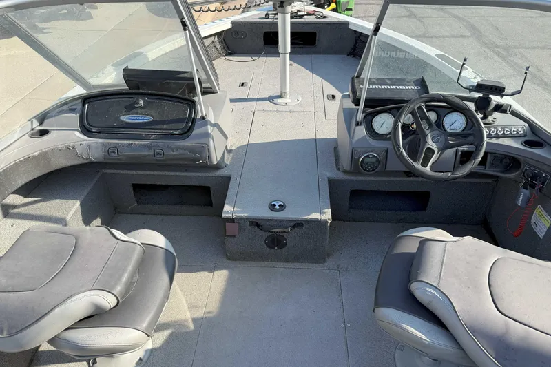Slide: The Image of 2017 Crestliner 1950 Fish Hawk boat interior with dual seats and control panel. - 3