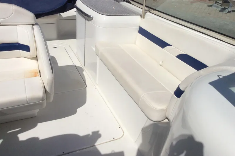 Slide: The Image of 2005 Formula 260 Bowrider interior with white and blue seating. - 11