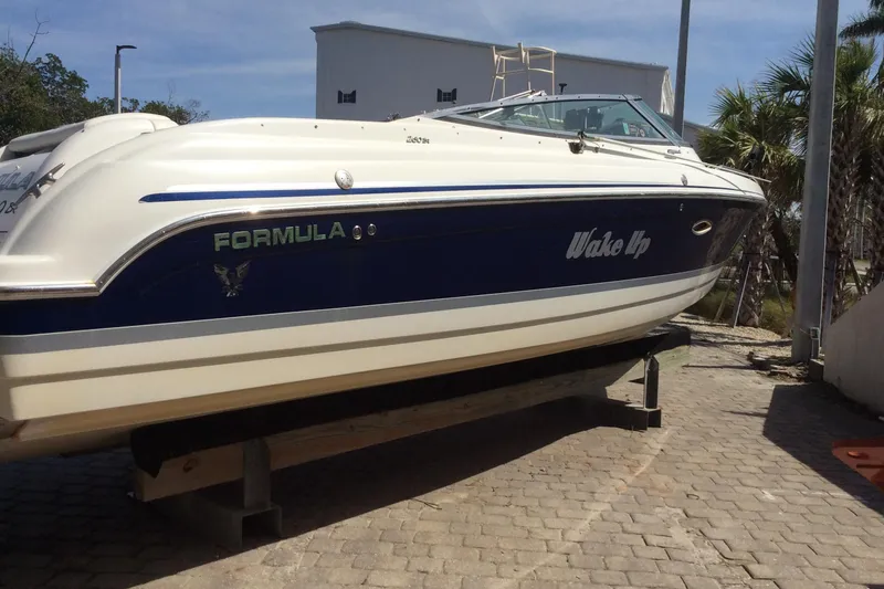 Slide: The Image of 2005 Formula 260 Bowrider boat on display, featuring sleek design and "Wake Up" branding. - 14