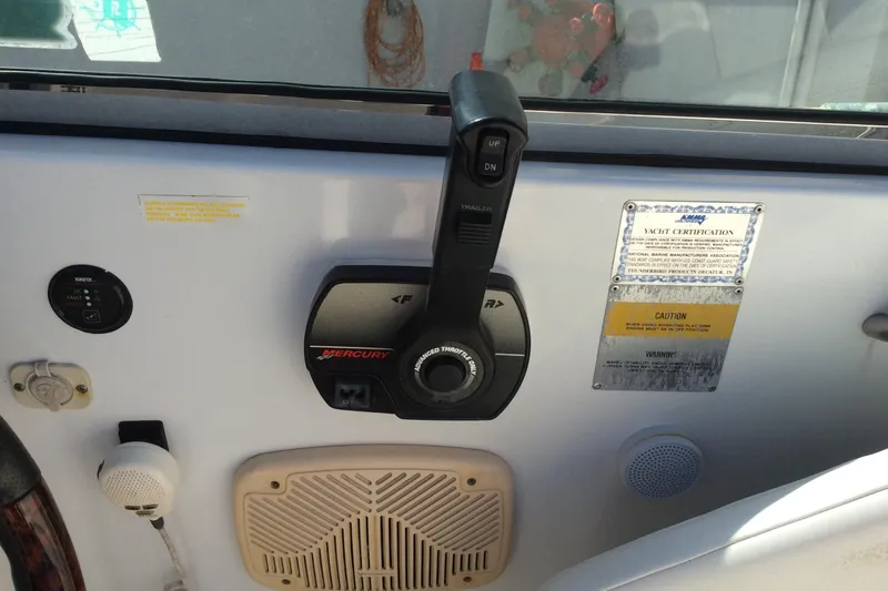 Slide: The Image of Control panel of a 2005 Formula 260 Bowrider boat with Mercury throttle. - 5