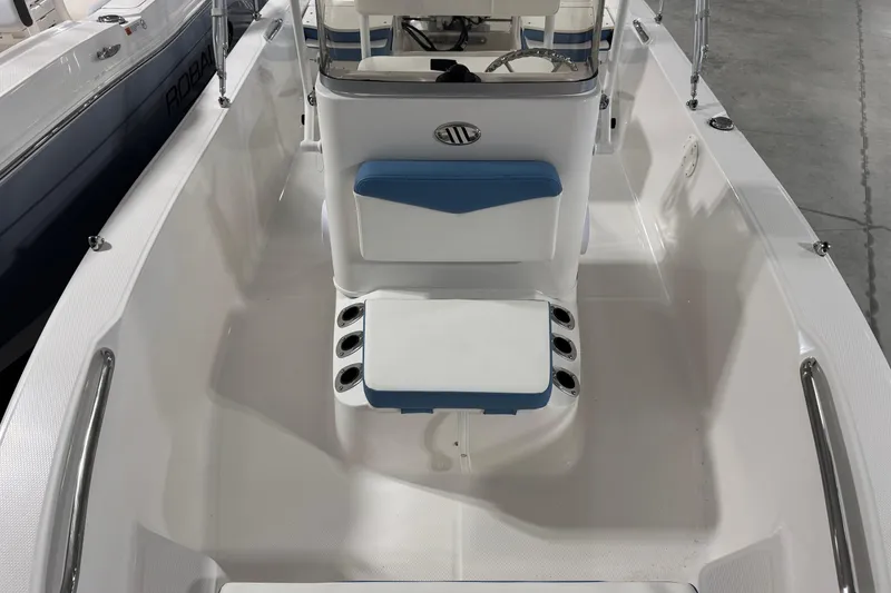 Slide: The Image of 2026 Robalo R160 Center Console boat interior with seating and console view. - 12