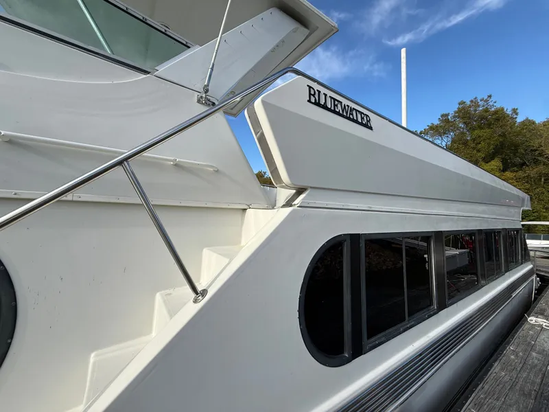 Slide: The Image of 1996 Bluewater Yachts 643 Motor Yacht with sleek design and modern windows. - 12