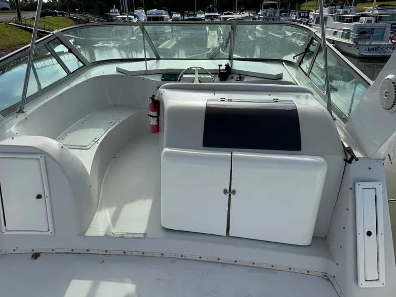 Slide: The Image of 1996 Bluewater Yachts 643 Motor Yacht cockpit with seating and storage compartments. - 23