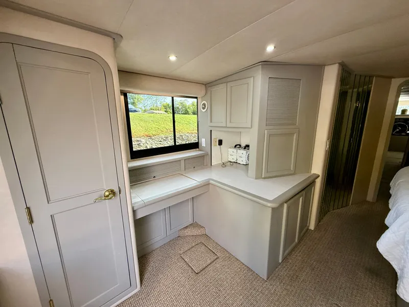 Slide: The Image of Interior of 1996 Bluewater Yachts 643 Motor Yacht with modern cabinetry and window view. - 31