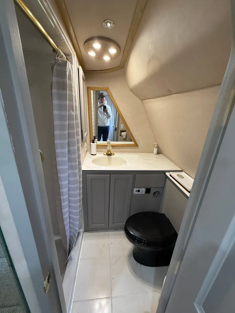 Slide: The Image of Bathroom interior of 1996 Bluewater Yachts 643 Motor Yacht, featuring shower and vanity. - 33