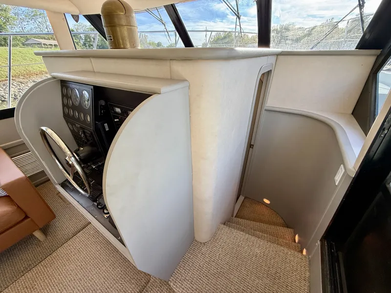 Slide: The Image of Interior helm of 1996 Bluewater Yachts 643 Motor Yacht with steering wheel and control panel. - 41