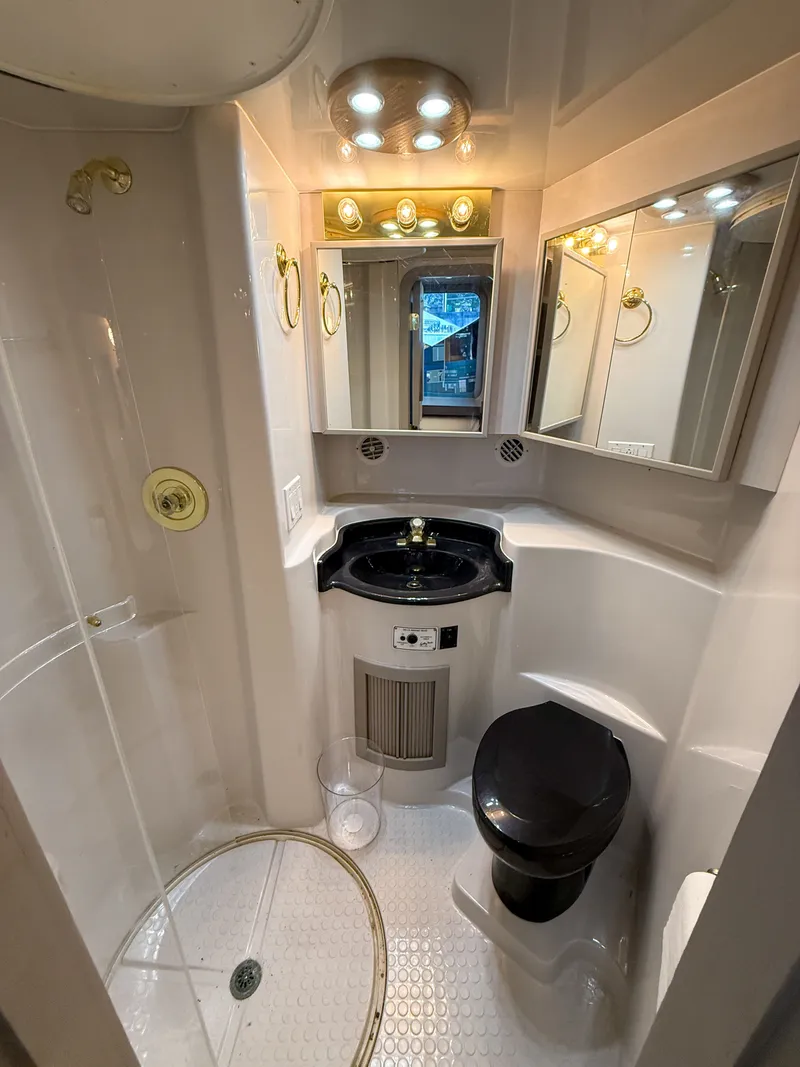 Slide: The Image of Luxurious bathroom in 1996 Bluewater Yachts 643 Motor Yacht with modern fixtures and lighting. - 43