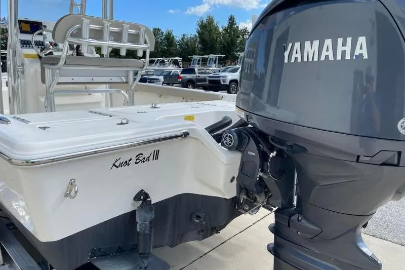 Slide: The Image of 2024 Key West 210 Bay Reef boat with Yamaha outboard motor, rear view. - 14