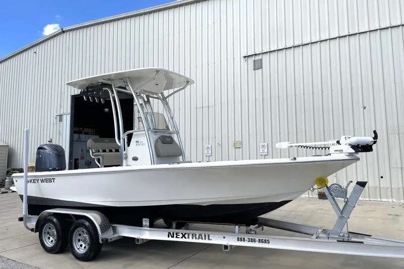 Slide: The Image of 2024 Key West 210 Bay Reef boat with Yamaha engine on trailer. - 2