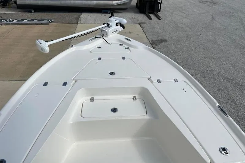 Slide: The Image of 2024 Key West 210 Bay Reef boat anchor compartment with wiring and open hatch. - 20