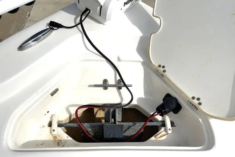 Slide: The Image of Minn Kota trolling motor on 2024 Key West 210 Bay Reef boat, docked outdoors. - 21