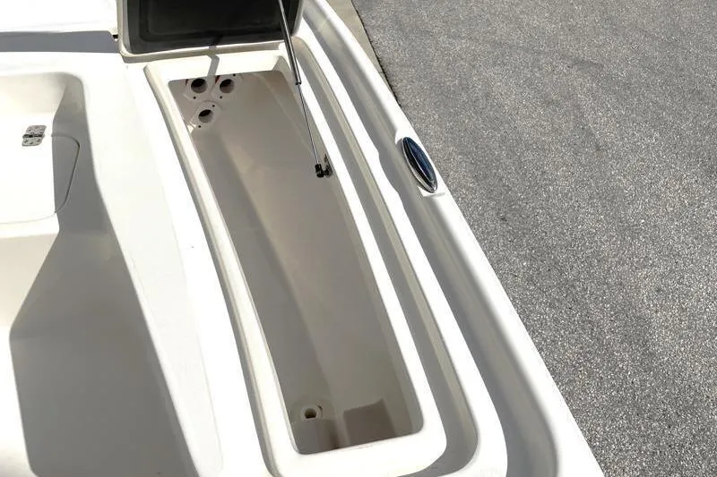 Slide: The Image of 2024 Key West 210 Bay Reef boat interior with cushioned seating and stainless steel supports. - 26