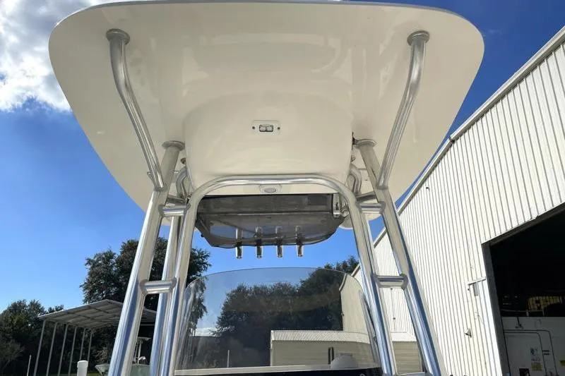 Slide: The Image of 2024 Key West 210 Bay Reef boat interior with seating and cup holders. - 28