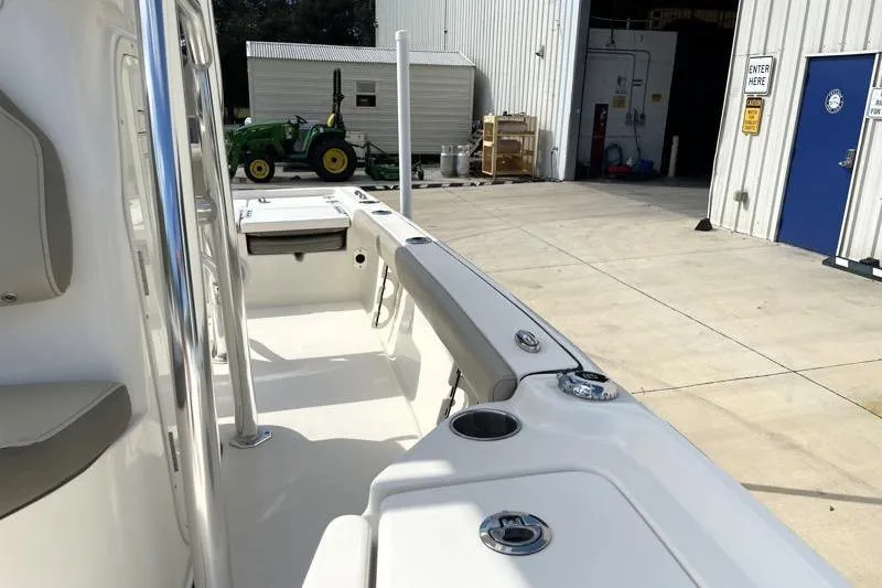 Slide: The Image of 2024 Key West 210 Bay Reef boat console with storage compartment and seating. - 30