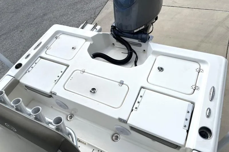 Slide: The Image of 2024 Key West 210 Bay Reef boat interior with seating and motor. - 38