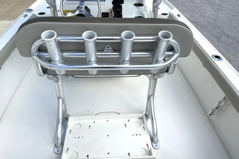 Slide: The Image of 2024 Key West 210 Bay Reef boat T-top with rod holders under blue sky. - 41