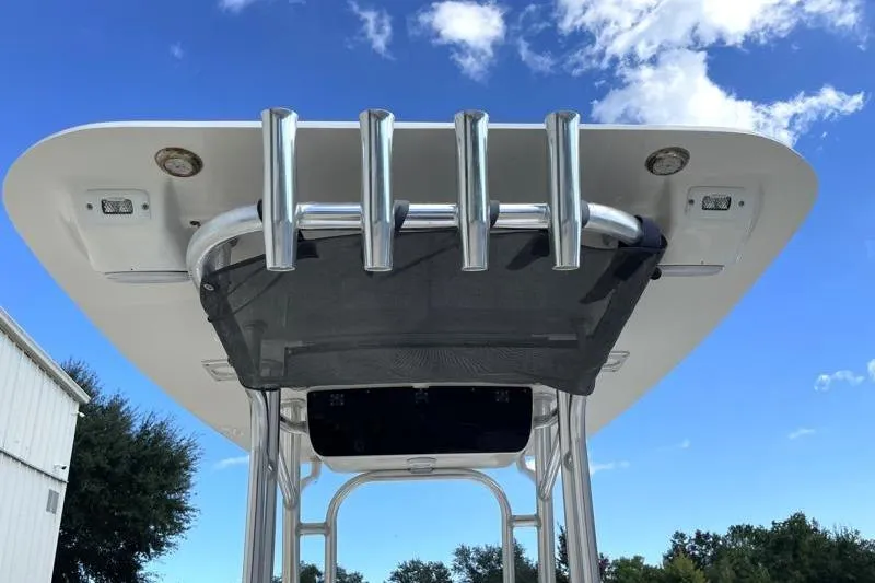 Slide: The Image of 2024 Key West 210 Bay Reef boat interior with rod holders and clean white finish. - 42