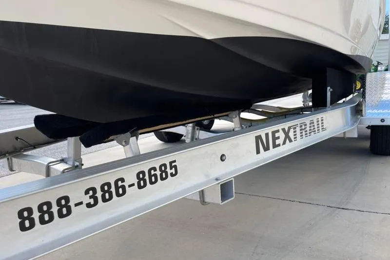 Slide: The Image of 2024 Key West 210 Bay Reef trailer with dual wheels and metal fender. - 46