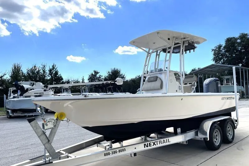 Slide: The Image of 2024 Key West 210 Bay Reef boat with Yamaha engine on trailer. - 5