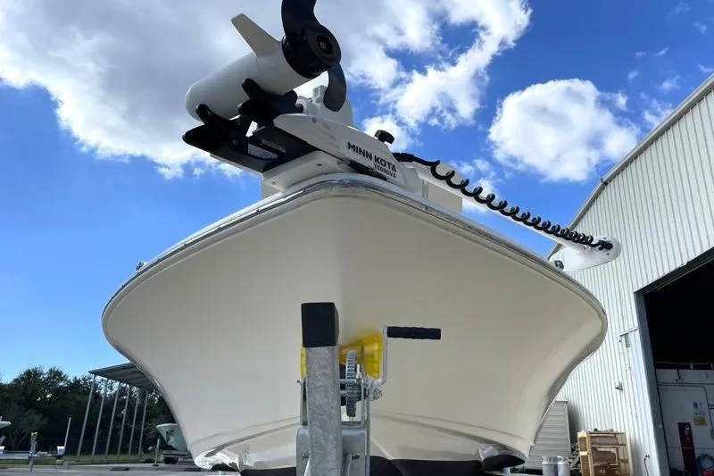 Slide: The Image of 2024 Key West 210 Bay Reef boat on trailer, parked outdoors. - 8