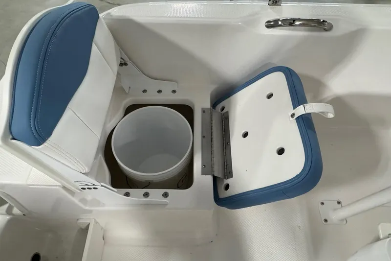 Slide: The Image of 2026 Robalo R160 Center Console seat with storage compartment and bucket. - 13