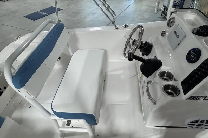 Slide: The Image of 2026 Robalo R160 Center Console boat interior with steering wheel and seating. - 16