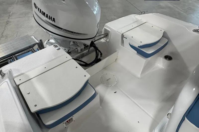 Slide: The Image of 2026 Robalo R160 Center Console boat with Yamaha engine, featuring white and blue seating. - 15