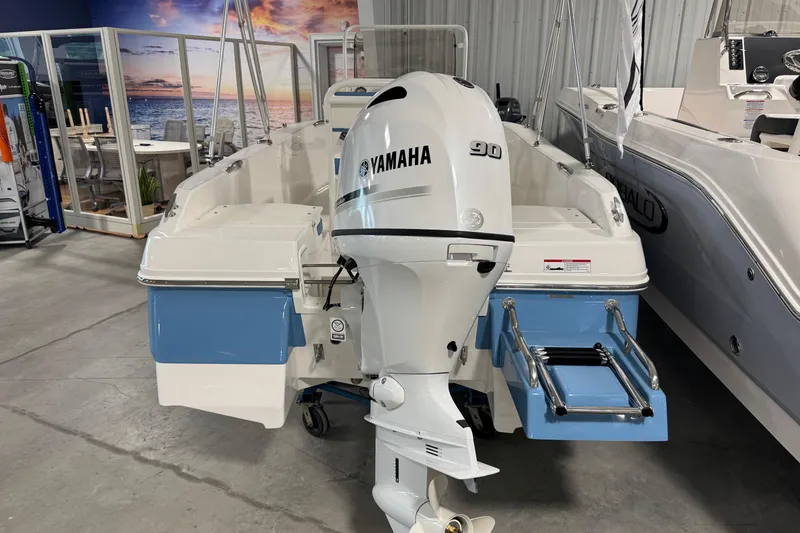 Slide: The Image of 2026 Robalo R160 Center Console with Yamaha 90 engine in showroom. - 4