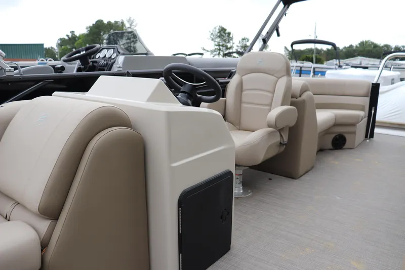 Slide: The Image of 2025 Flagship Endurace 22 CU boat interior with beige seating and steering console. - 5