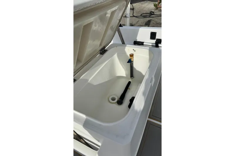 Slide: The Image of Open storage compartment on 1997 Seaswirl 1730 CC Striper boat, showing interior details. - 10