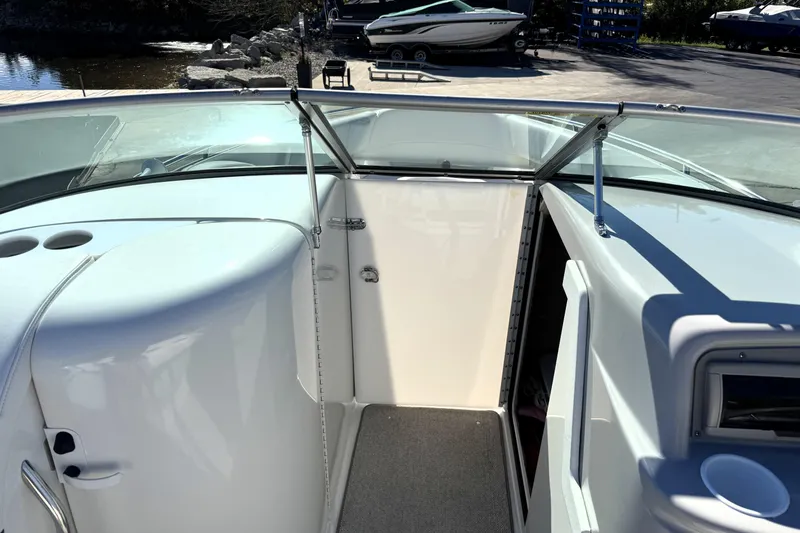 Slide: The Image of 2000 Formula 260 Bowrider interior with open cabin door and sleek design. - 13