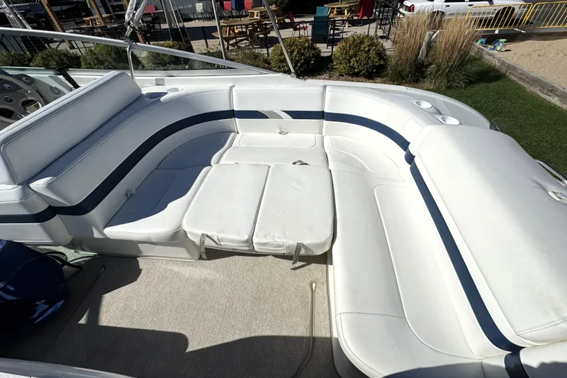 Slide: The Image of 2000 Formula 260 Bowrider boat interior with white and blue seating arrangement. - 16