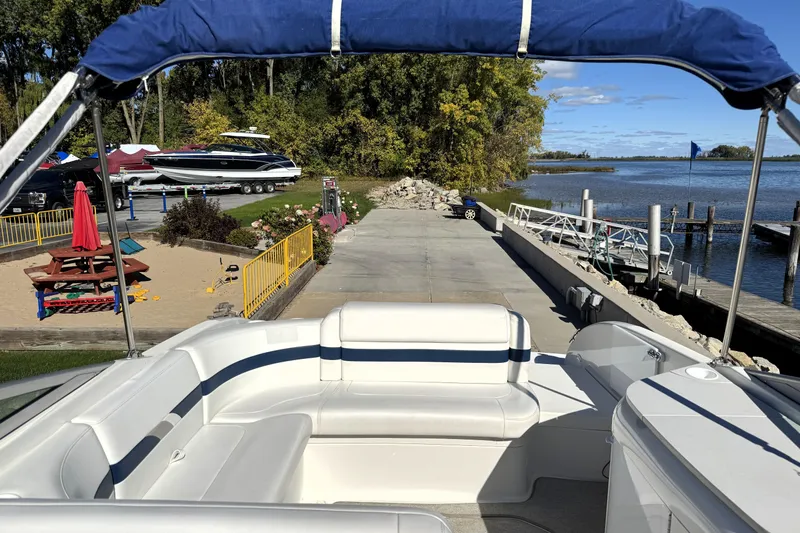 Slide: The Image of 2000 Formula 260 Bowrider at dock, scenic waterfront view, sunny day. - 28