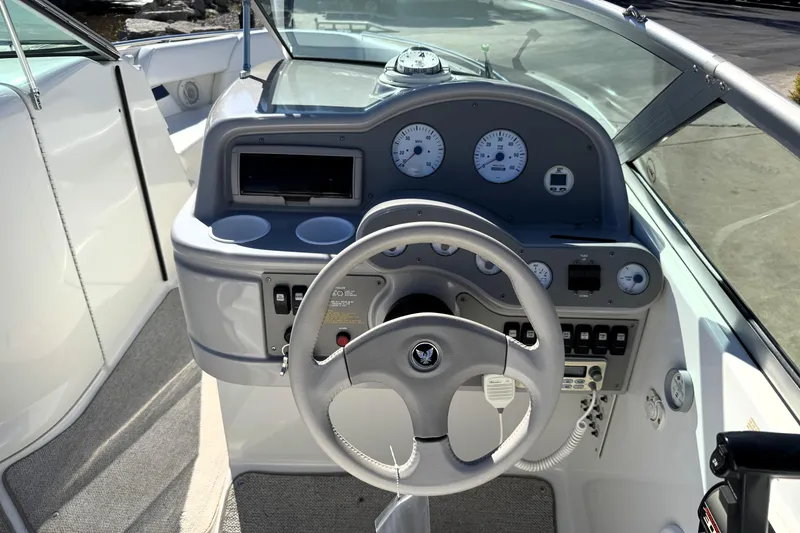 Slide: The Image of Steering console of a 2000 Formula 260 Bowrider boat with gauges and controls. - 9
