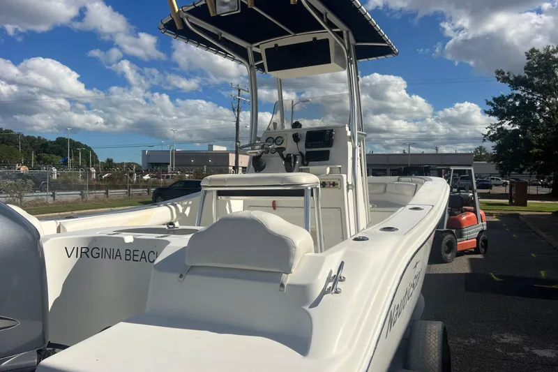 Slide: The Image of 2007 NauticStar 2000 Offshore boat in Virginia Beach, parked outdoors under a cloudy sky. - 10