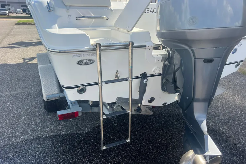 Slide: The Image of Rear view of 2007 NauticStar 2000 Offshore boat with outboard motor and ladder. - 11