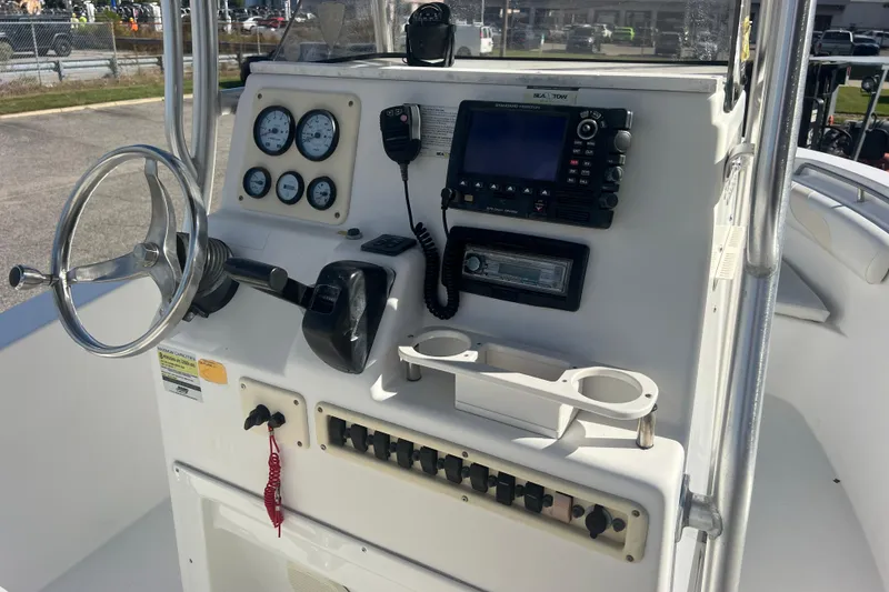 Slide: The Image of Control panel of a 2007 NauticStar 2000 Offshore boat with steering wheel and gauges. - 22