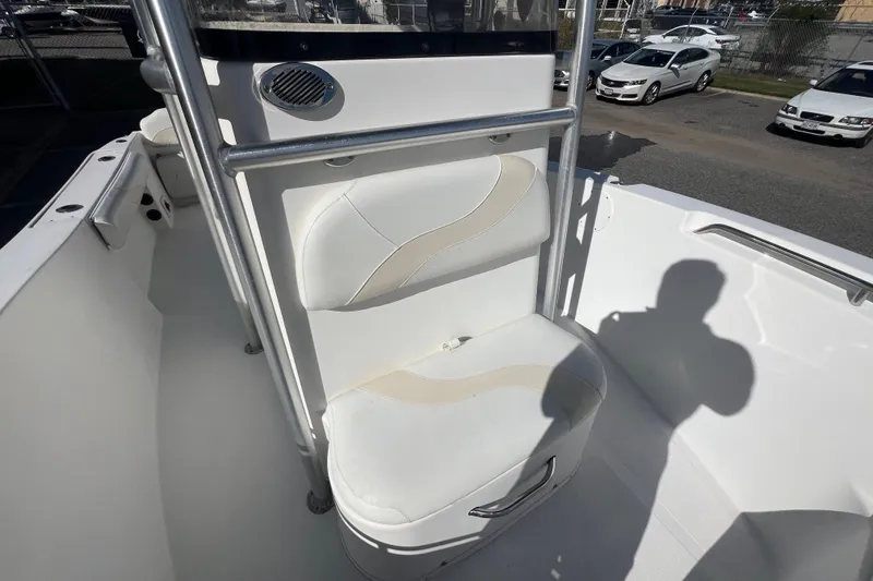 Slide: The Image of 2007 NauticStar 2000 Offshore boat interior with white seating and metal railings. - 24