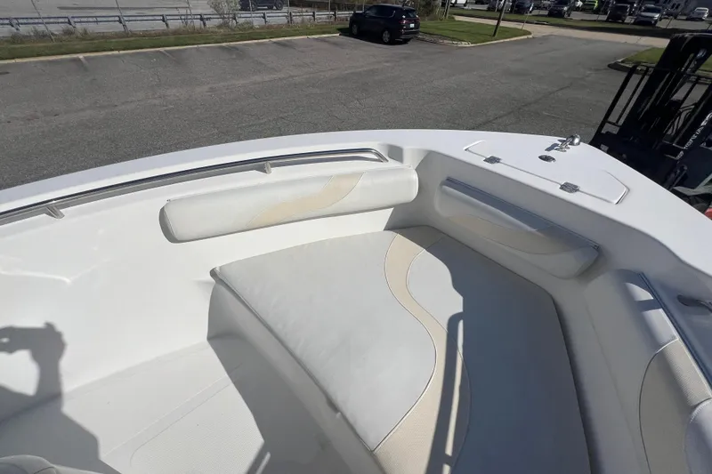 Slide: The Image of 2007 NauticStar 2000 Offshore boat interior with cushioned seating and storage compartments. - 25