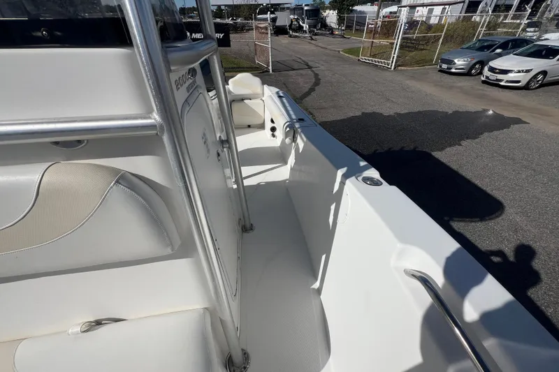 Slide: The Image of 2007 NauticStar 2000 Offshore boat interior with white seating and metal railings. - 26