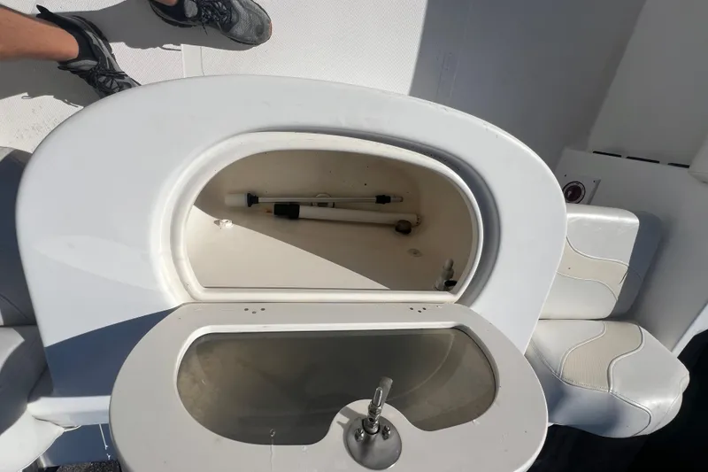 Slide: The Image of 2007 NauticStar 2000 Offshore boat interior with storage compartment and seating. - 34