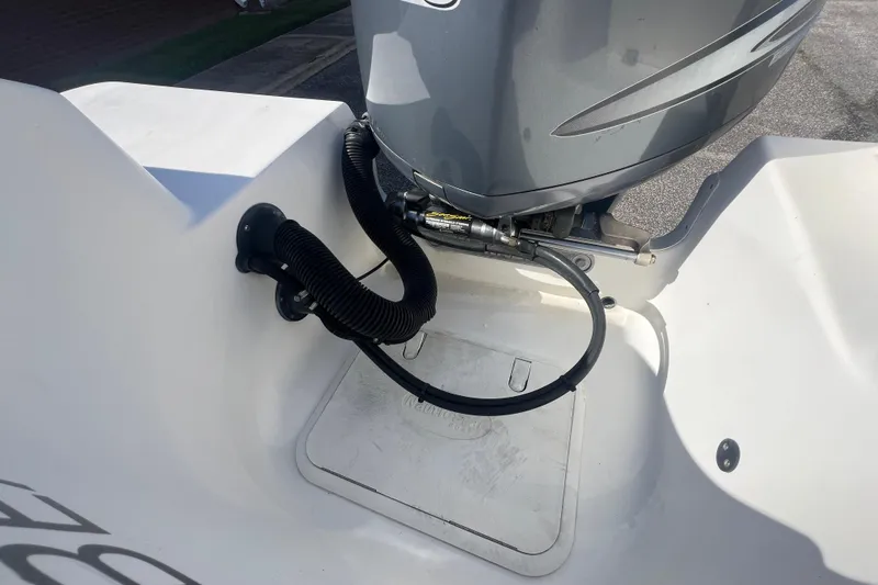 Slide: The Image of 2007 NauticStar 2000 Offshore boat engine area with hydraulic steering and cables. - 35